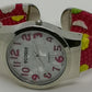 Fashion watch with red bangle strap with white, yellow and green polka dots, large numbers