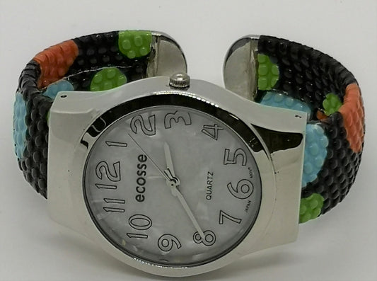 Fashion Bangle style watch with black strap with blue, orange and green polka dots